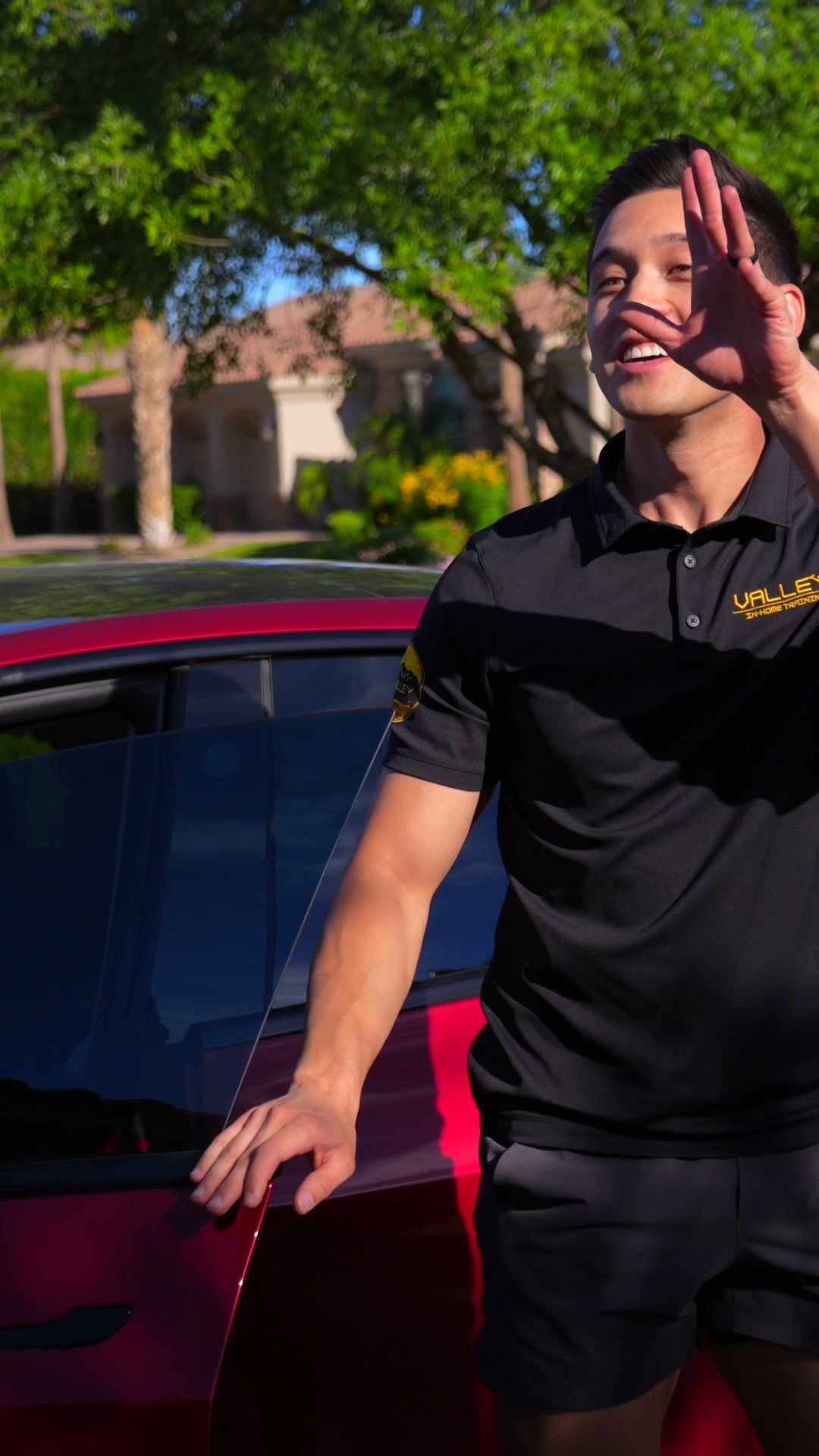 Valley In-Home Training trainer stepping out of his car and waving in a client’s driveway