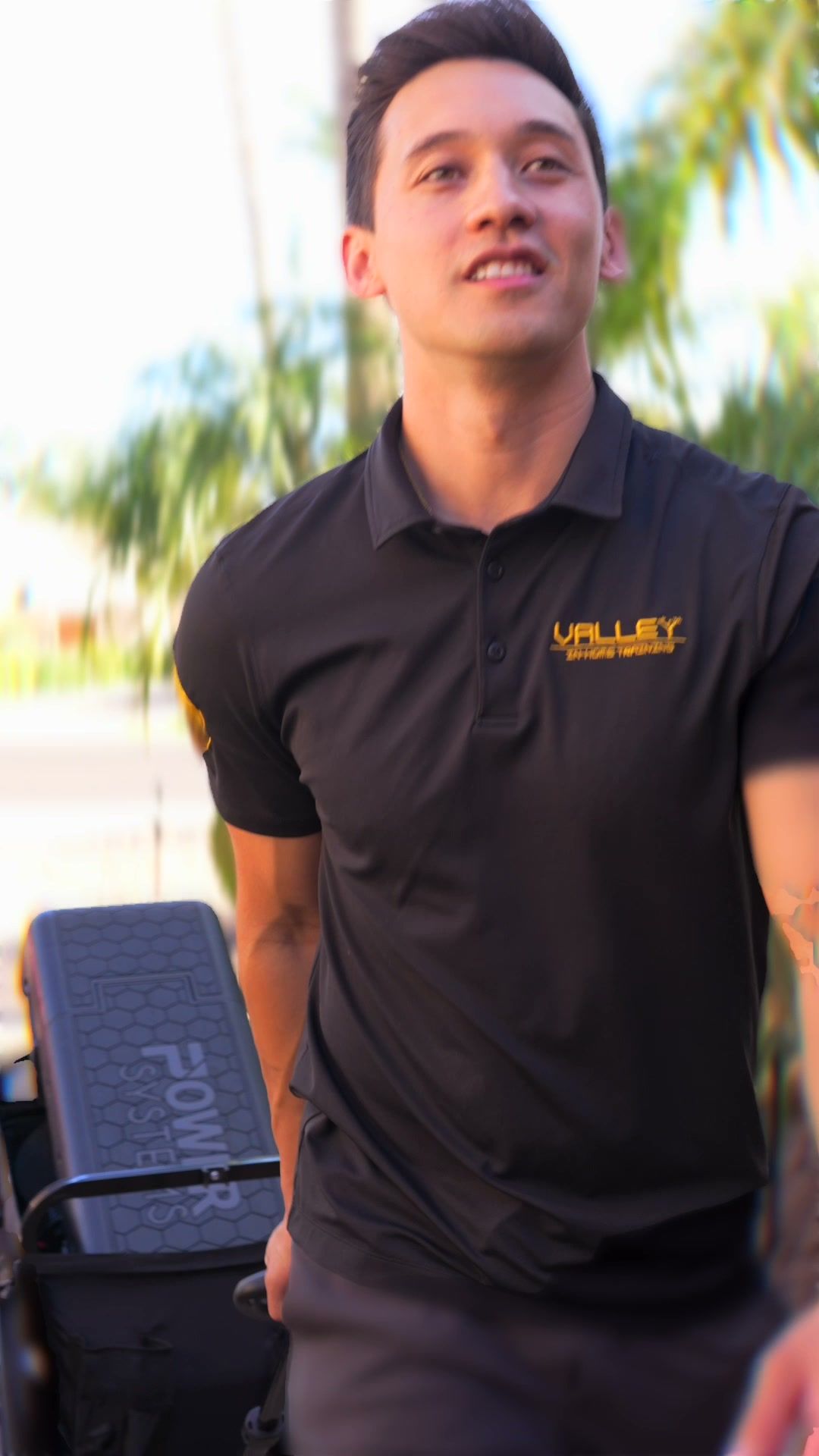 Smiling trainer arriving at a client’s home with equipment